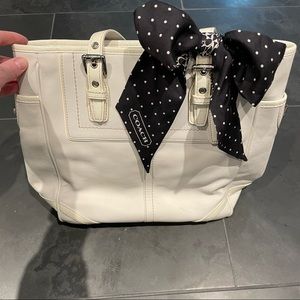 Coach purse with adorable tie accessory
